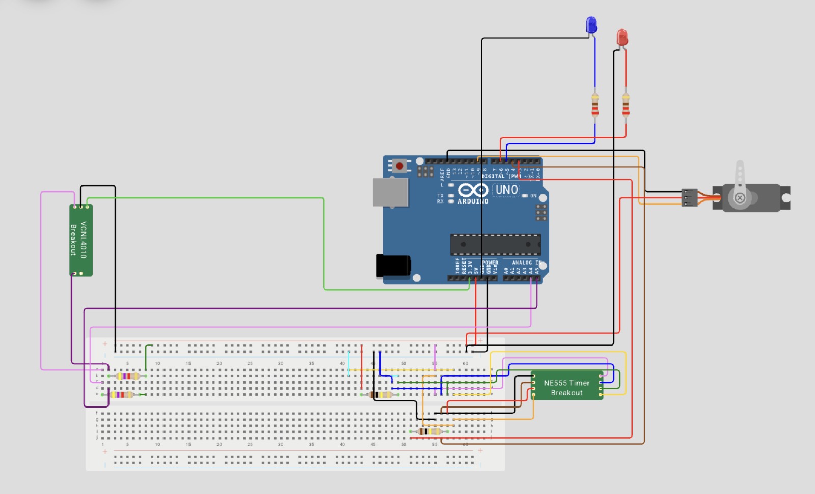 Full circuit diagram built in Wokwi, showing the Arduino Uno, VCNL4010 breakout, NE555 timer breakout, servo, and LED wiring on a breadboard.